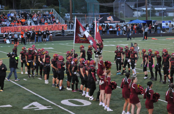 The PHS varsity football team getting announced and running out before a big game. 