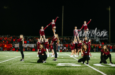 Falcon Cheer and dance stunt at home field against school rival Battleground High School.
