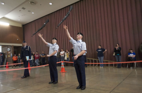 JROTC performs a gun demonstration in the commons in preparation for the assembly. 