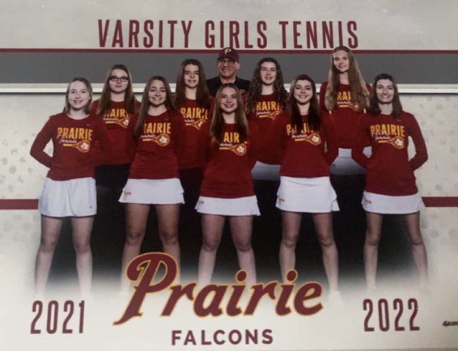 The girls tennis team poses for their team picture.