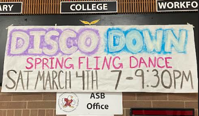 A sign above the ASB office promoting the dance.