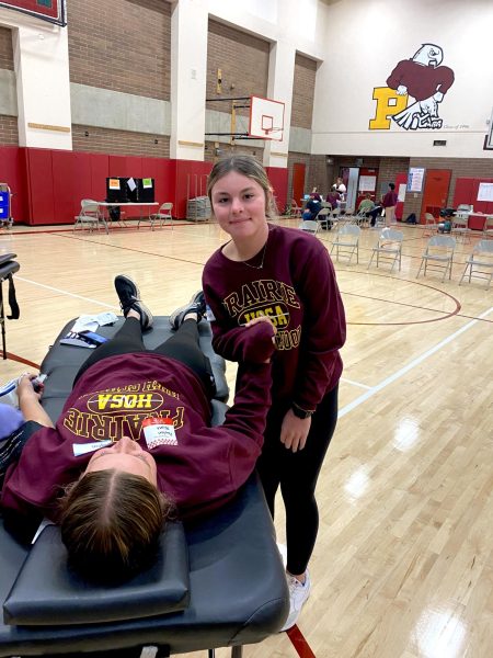 HOSA Members Payton Blunt (left) and Peyton Miller (right) helping  give blood at the blood drive!