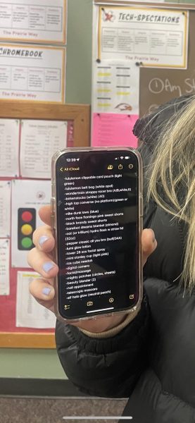 Senior Maddy Moore showing off her Christmas list on her phone.