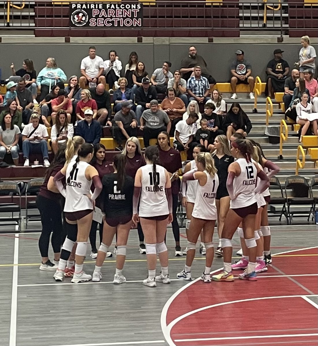 The Prairie Volleyball team in a huddle during their game against Columbia River.