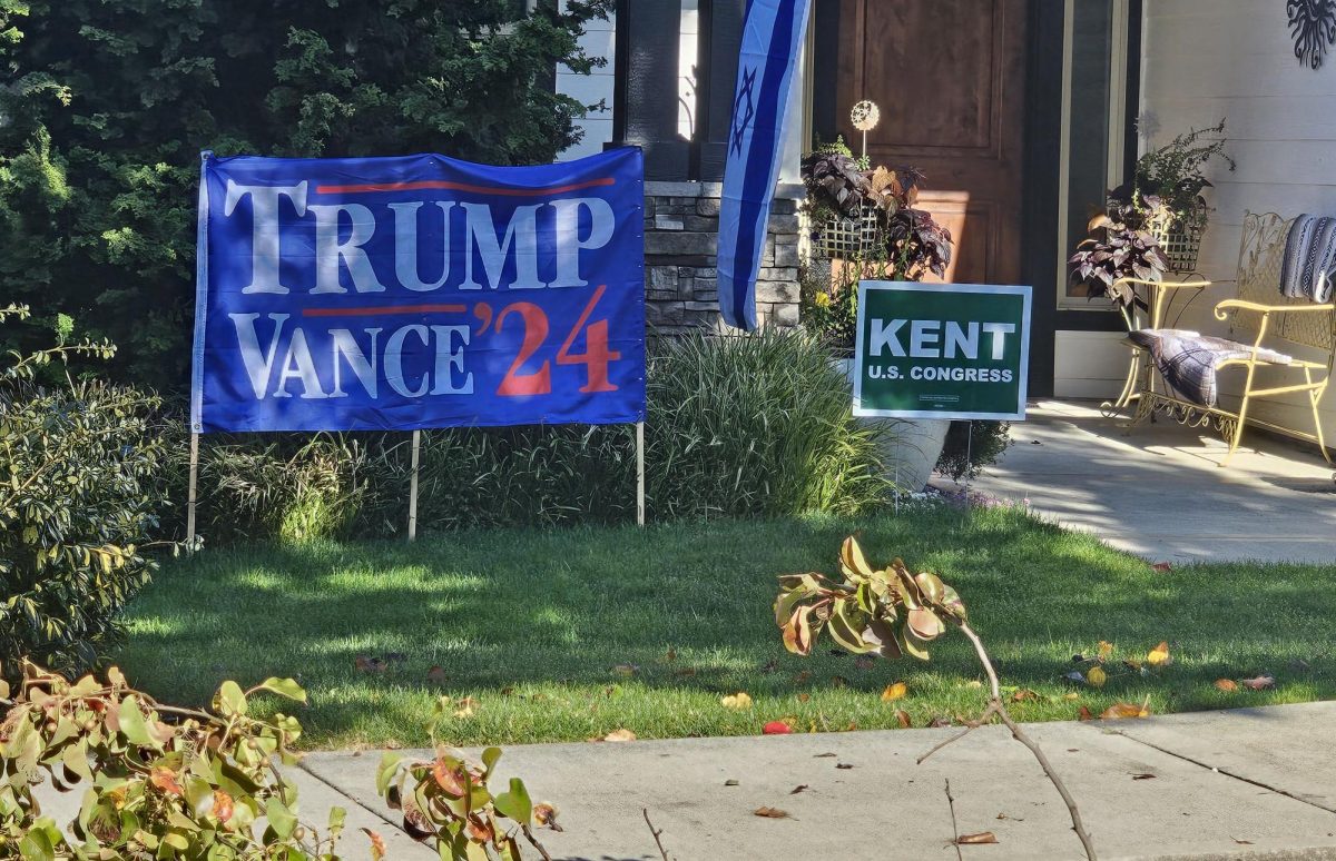 Political Signs in front yard to support Donald Trump and JD Vance. Trump and Vance ended up winning the popular vote.