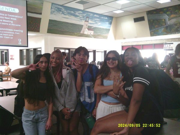 The ASB group taking a photo in the School's Library.
