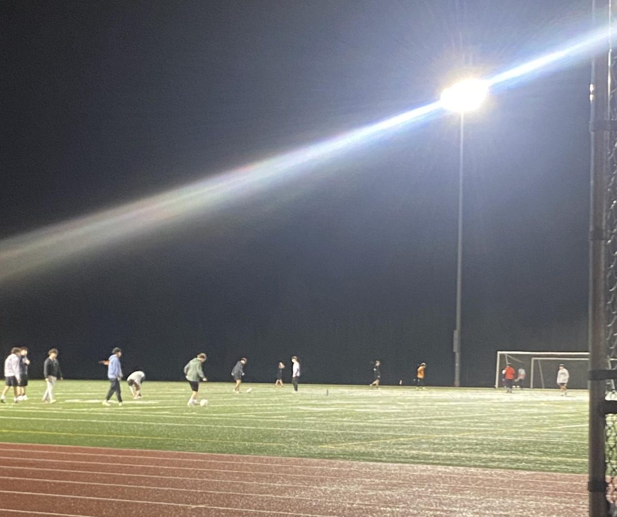 Prairie boys soccer team warming up to scrimmage one another.