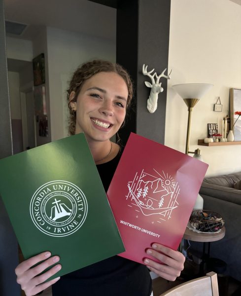 Jules Staley (Senior) holds her first acceptance letters, from Concordia University and Whitworth University. 