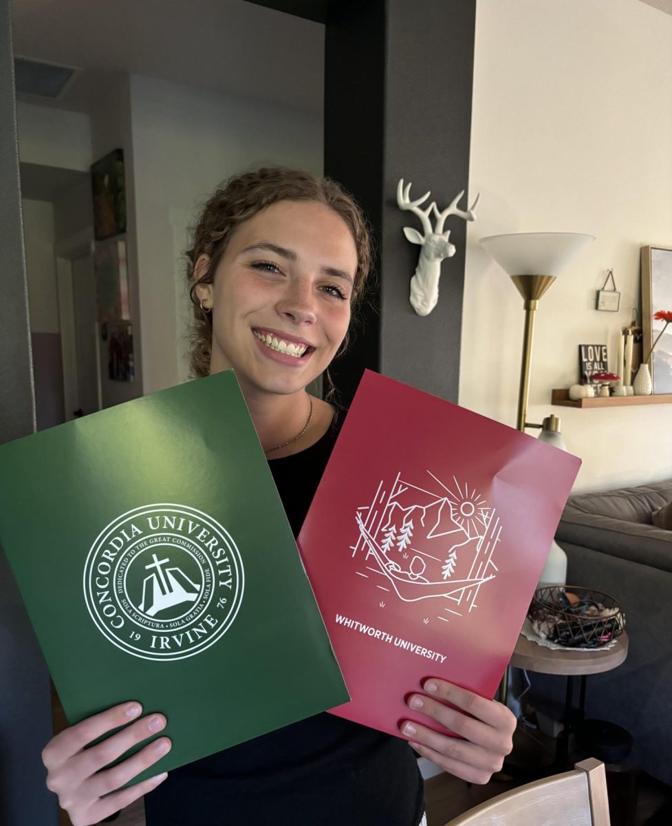 Jules Staley (Senior) holds her first acceptance letters, from Concordia University and Whitworth University. 