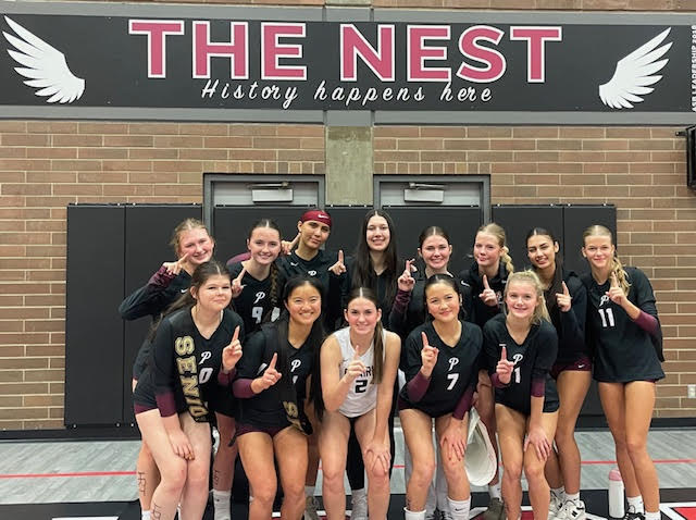 The Girls' Varsity Volleyball team on senior night.