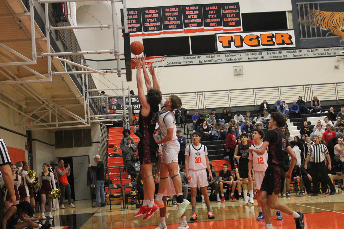 Junior Carson Morningstar (20) goes up for layup.