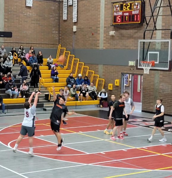 The excitement rises as #9, Sergio Aguilar, goes for a three-point attempt at last weekend's Unified Basketball Districts competition at Prarie High School on Saturday Fed 8.