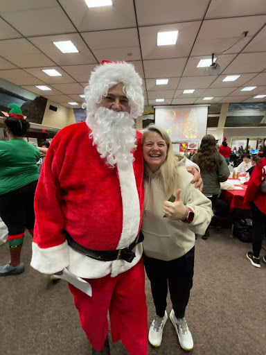  Santa (Coach Kapelka) and Mrs. Watts share a picture together at the winter carnival.