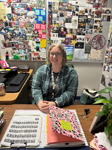 Mrs. Claflin at her desk ready to teach 