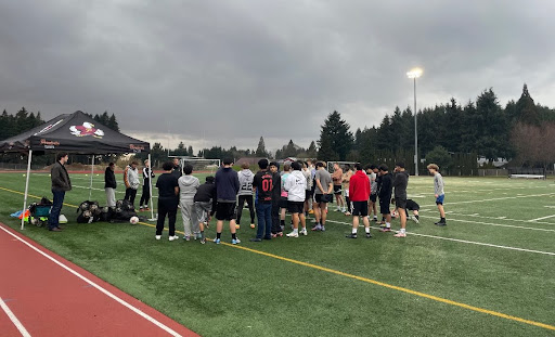 Boys soccer tryouts on a cloudy day. 