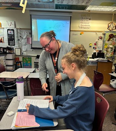Colleen Homola helping her student Bella during AP Statistics class.