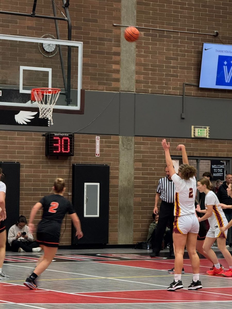 Junior Olivia Brown is shooting a free throw during the season opener girls rival basketball game against battleground High School on Tuesday.