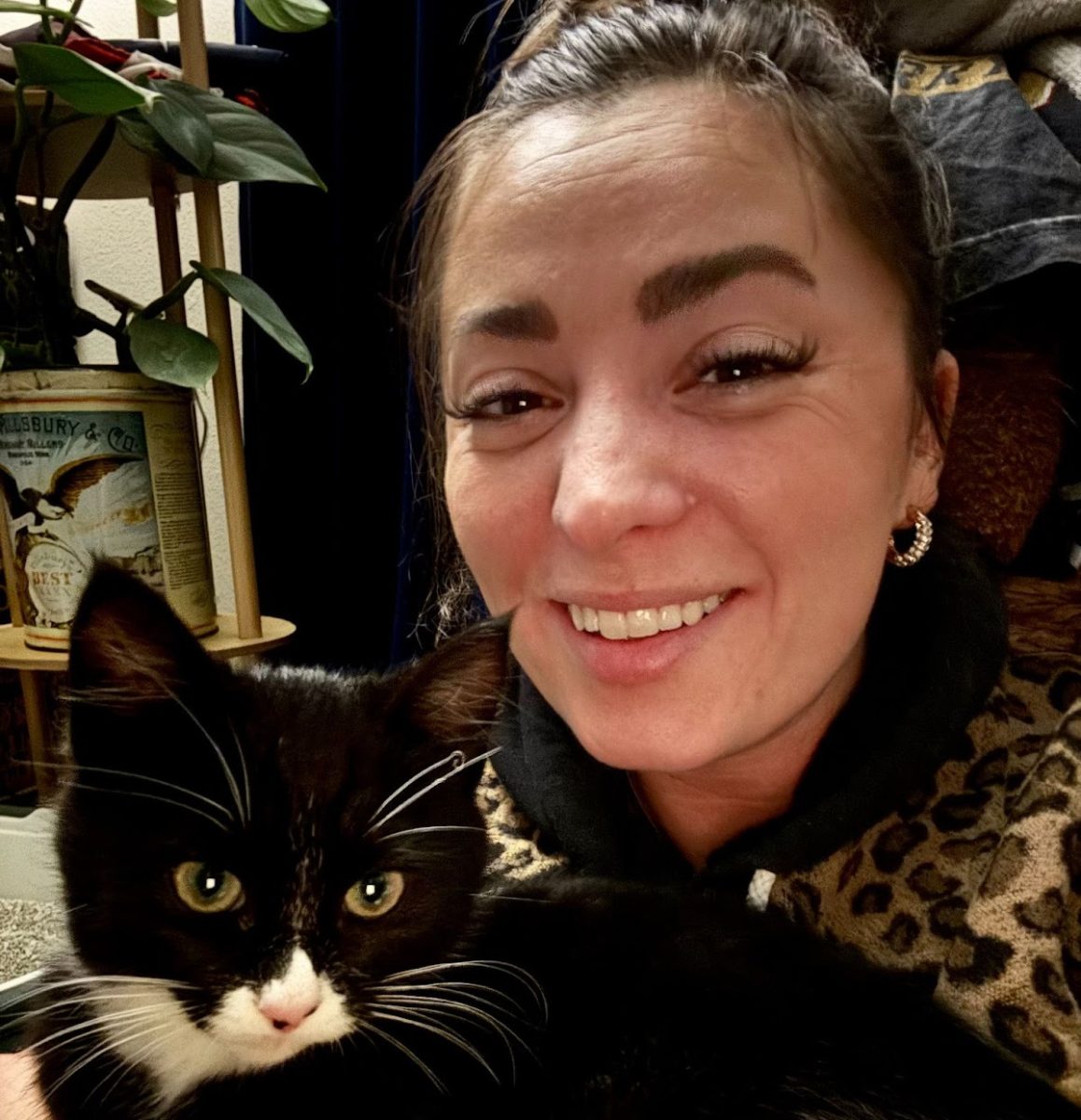 Deputy Quiggle and her delightful new furry friend Nugget sharing a sweet and memorable moment in the office on their very first day together—marking the start of a wonderful friendship.