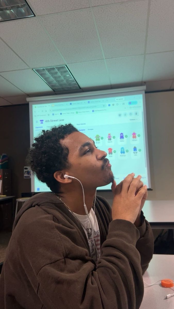 Senior Anthony Brown listening to music while in class.