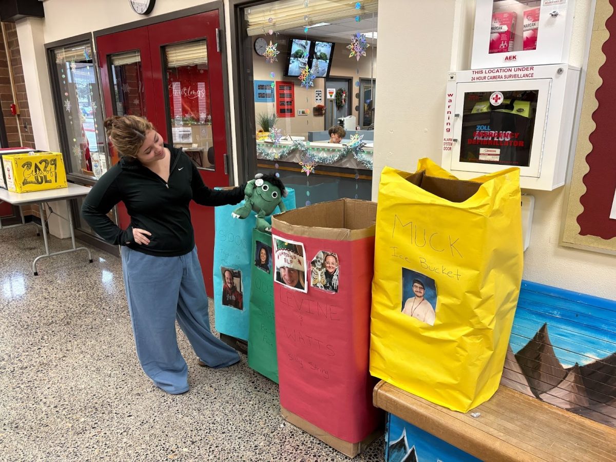 Claudia Ayala donates to the toy drive on Thursday during school.