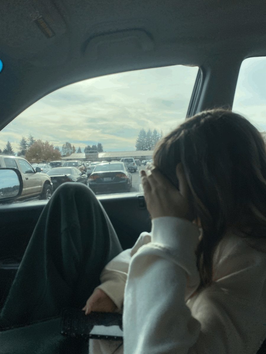 Daphne Dirks listening to “The Art of Loving” in her car.