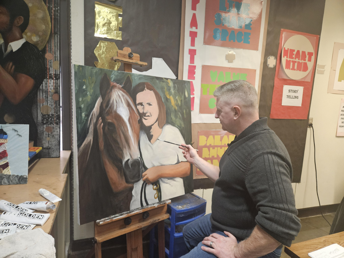 Robert Shadle loves to work on his personal pieces throughout the day while students work on art.