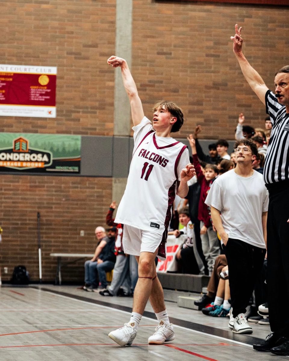 Peyton Poppe looking at a 3 point shot in the 3rd quarter of the game that he took.