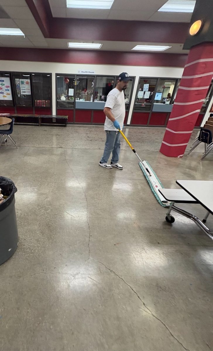 Brandon sweeping the commons.
