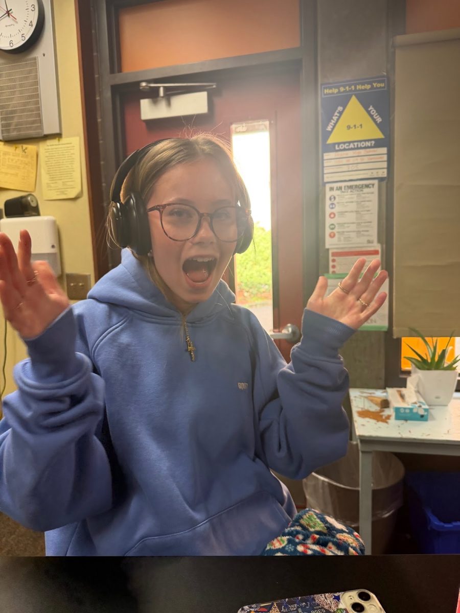 Sophia Werner listening to a hype playlist to get ready for dance.