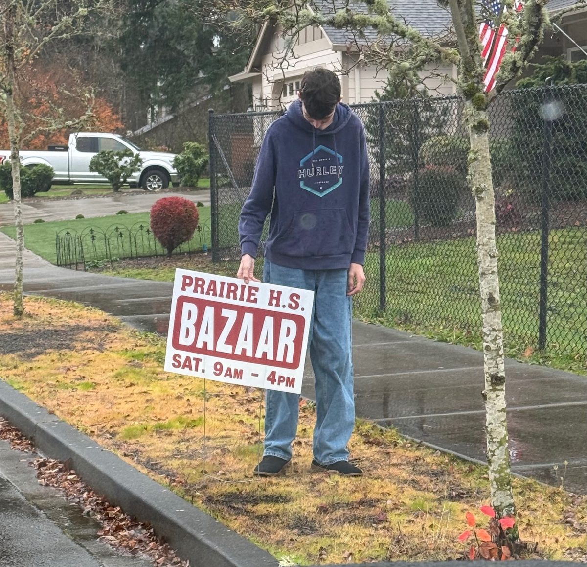 Student volunteer Brigham Sorenson, sophomore, pictured setting up promotional signs for the Bazaar.
