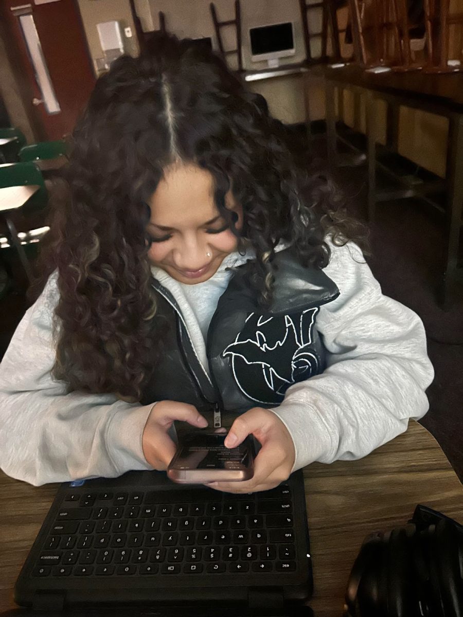 Kassidy Vaa-Leiataua (12) On her phone, writing her Christmas in First Period Journalism, on December 18th. “Im a little late, but writing my list is hard.” 