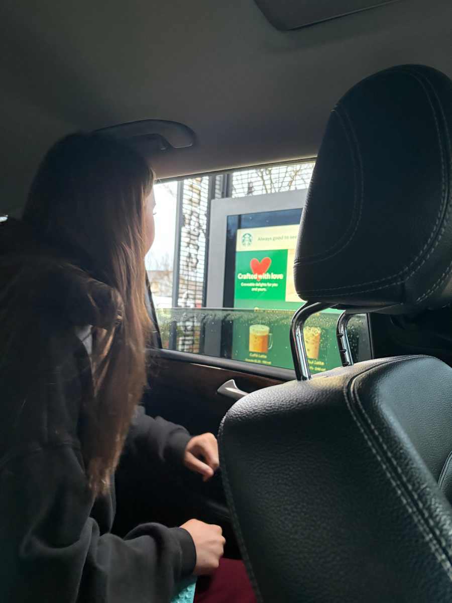 Ellie Moore ordering her strawberry cold foam and the cookie croissant swirl from Starbucks.
