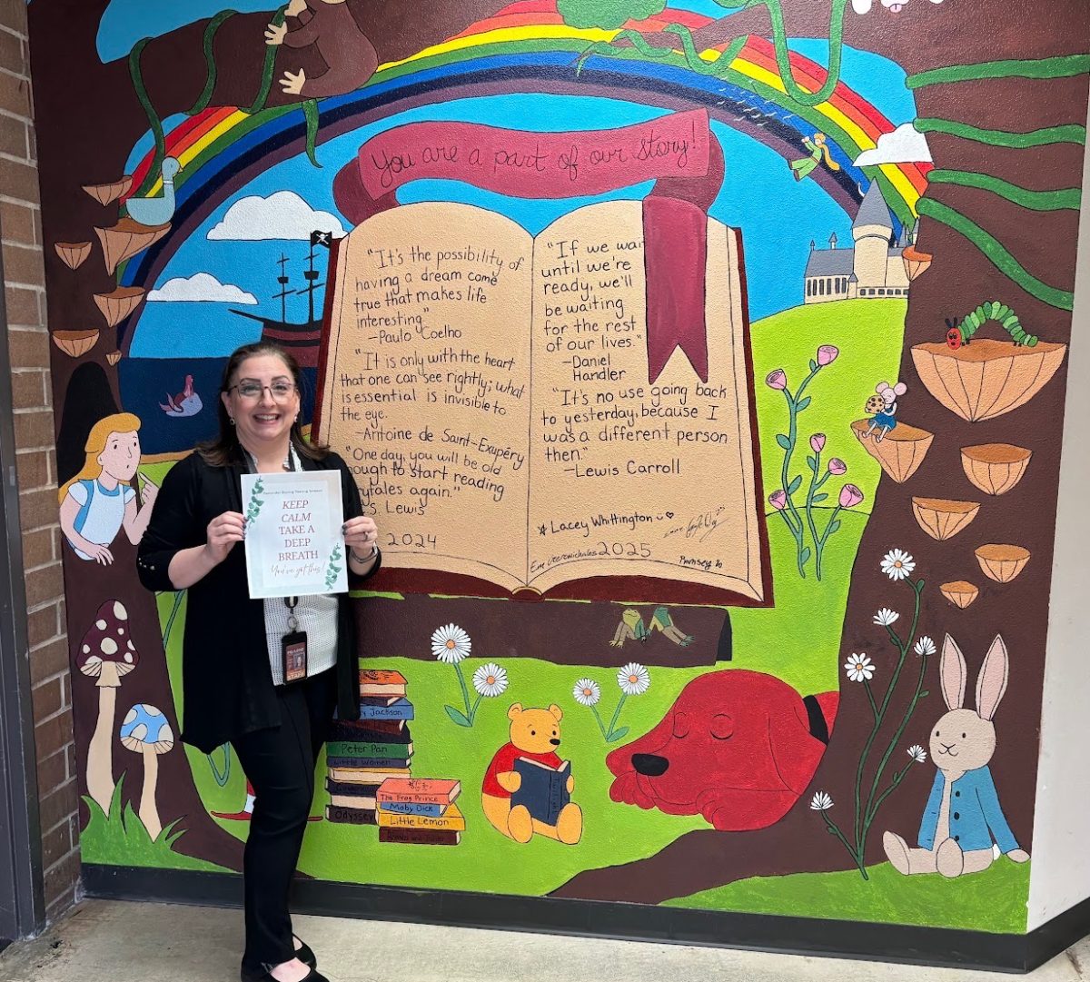 Ms Robin holding a sign saying “ keep calm, take a deep breath, you got this,” the reminder to students that staying calm and confident can help reduce stress during testing season. 
