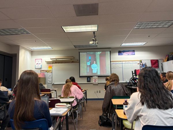 Students watching The Morning Announcements, a news source of its own done by Prairie staff and students.
