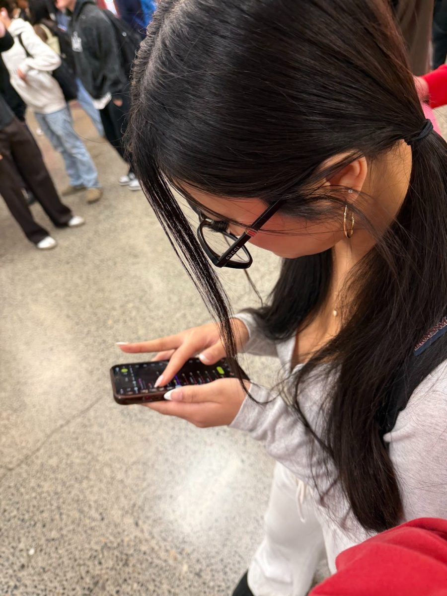 Student Ava Kleuy seen on her phone during school hours.