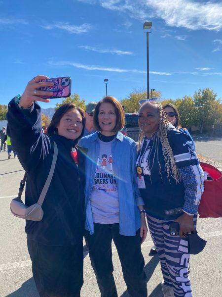 The photo depicts two of Emilia’s friends taking a photo with the senator of Nevada ( lady in blue) Catherine Cortez Masto. 